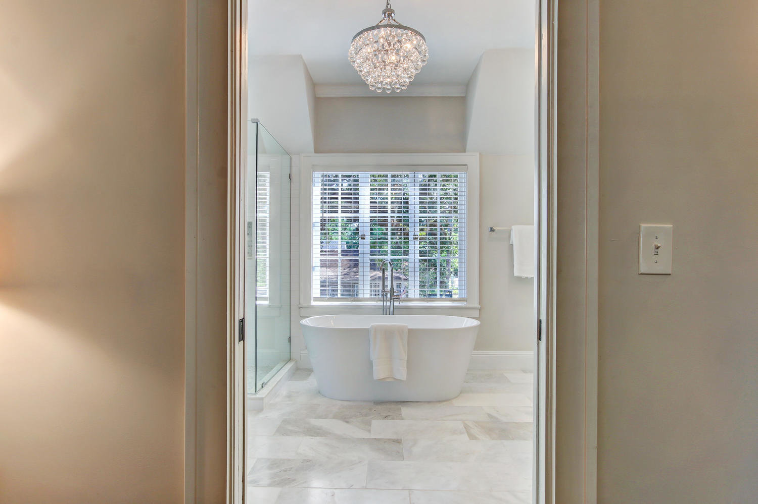 Master bathroom with large soaking tub and neutral colors